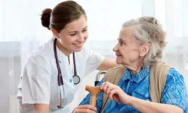 Medical Assistant Helping Patient